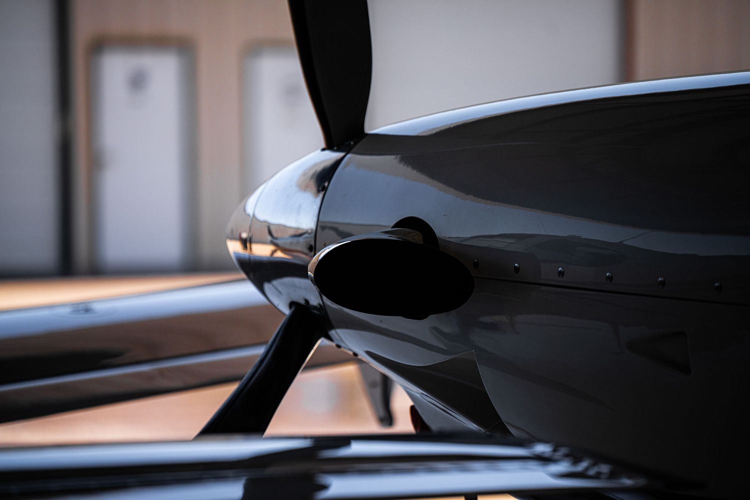 Dark silhouette of aircraft controls against bright window background.