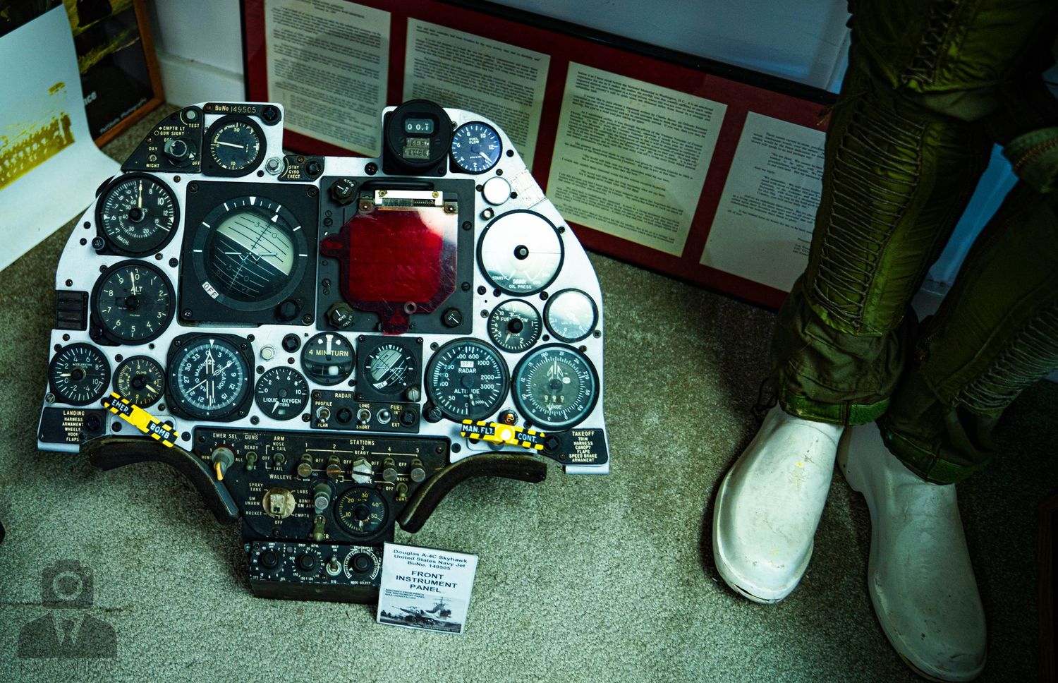 Aviation instruments and gauges arranged in a row showing cockpit equipment.
