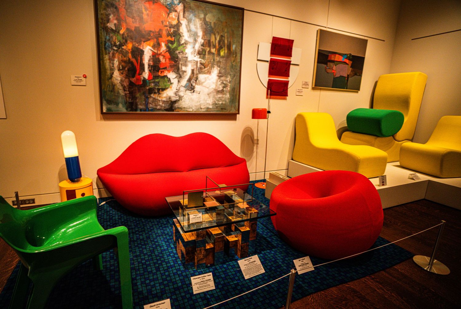 Colorful bean bag chairs and lounge seating arranged in a modern office or collaborative workspace area.