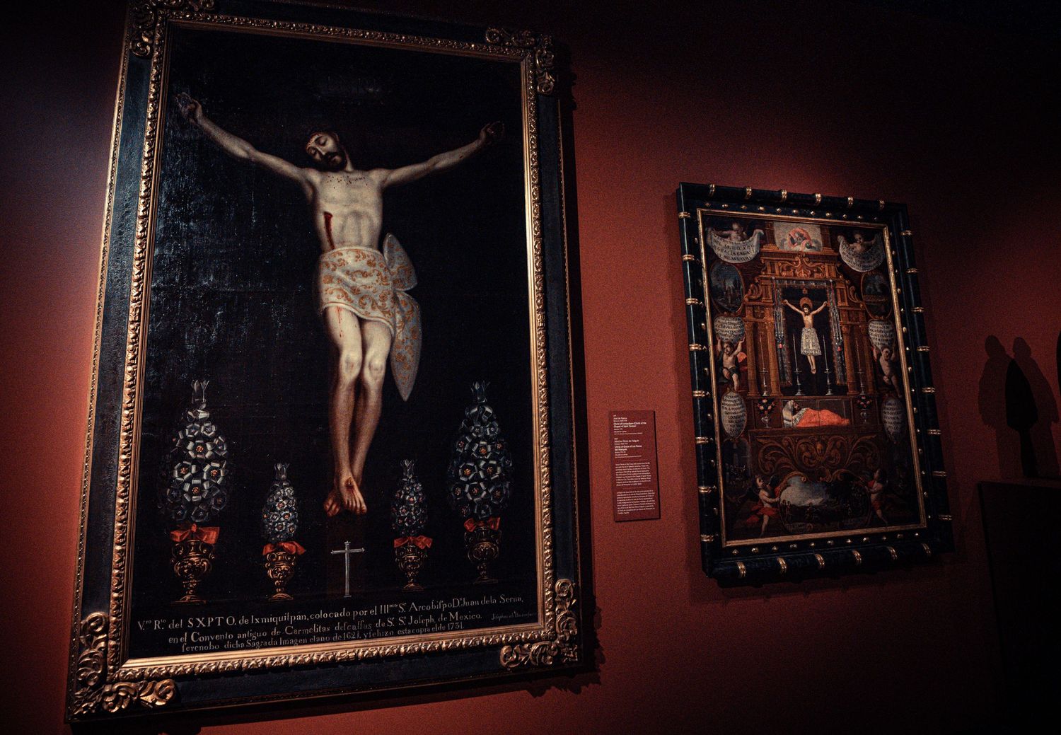 Dark artistic photographs of religious paintings and crucifixes displayed in a dimly lit museum or church setting.