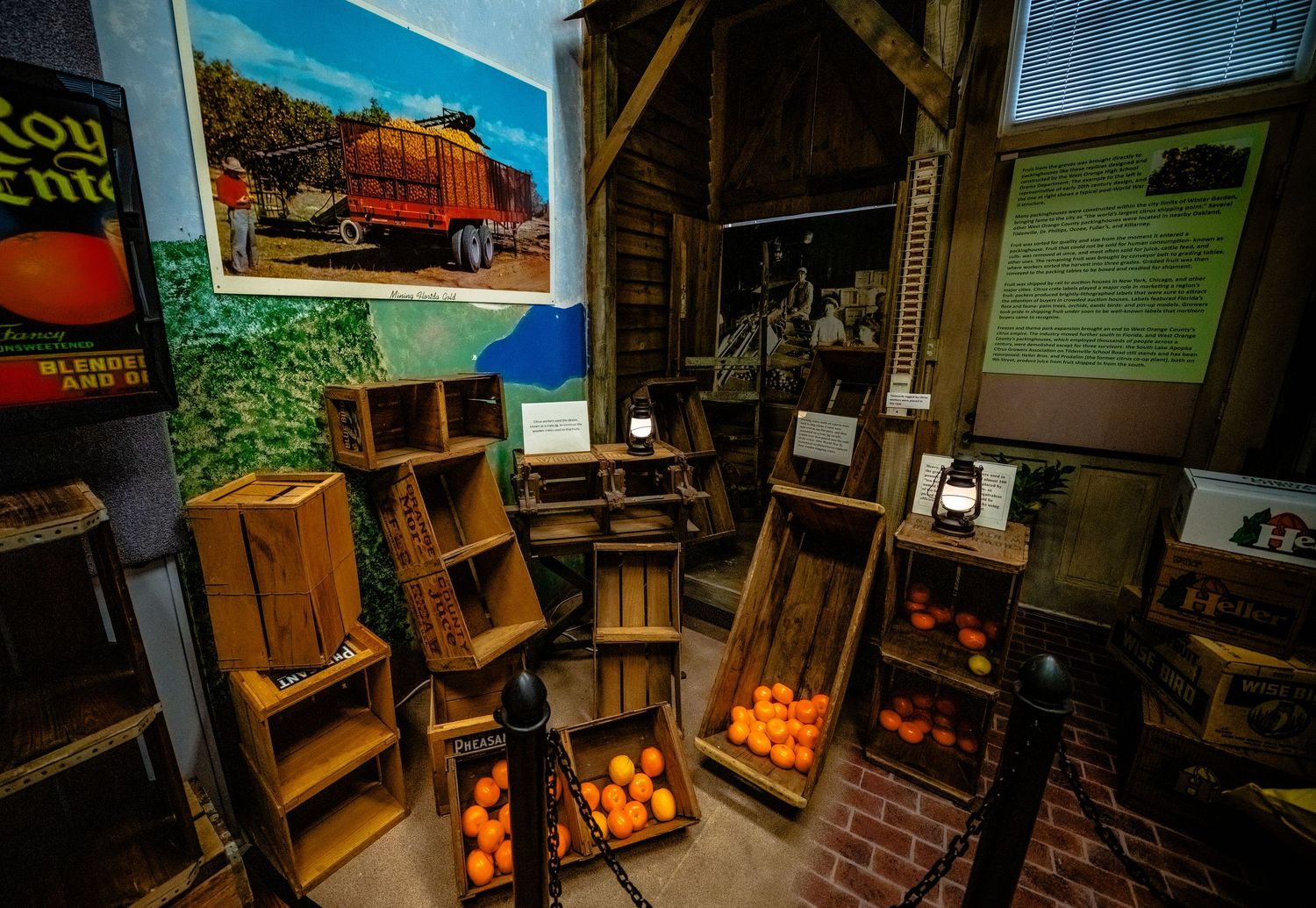 Vintage wooden furniture and antique items displayed in a museum room setting.