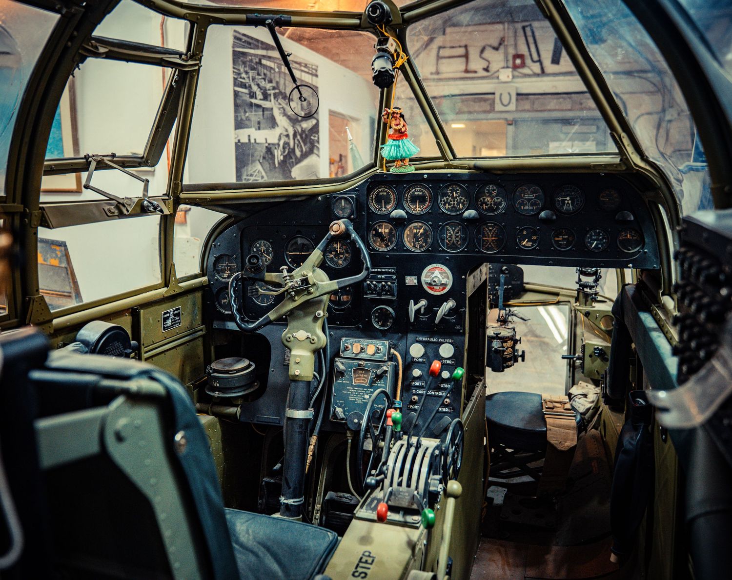 Detailed view of vintage aircraft cockpit controls and instrument panels.