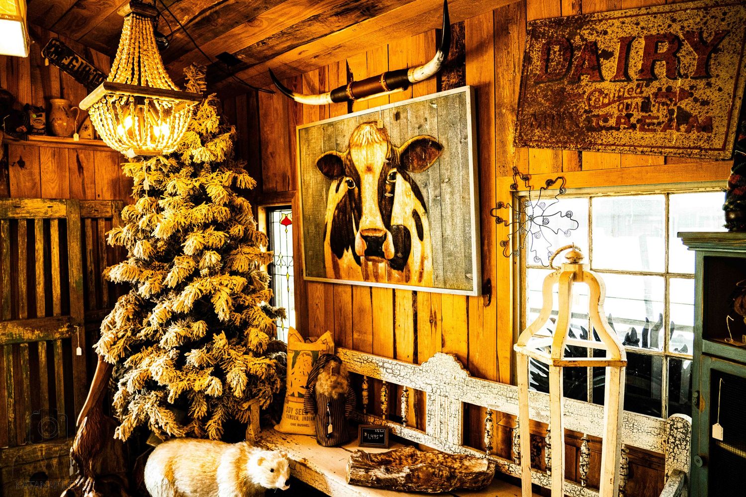 Rustic antique shop interior with warm lighting and vintage chandeliers creating a cozy ambiance.