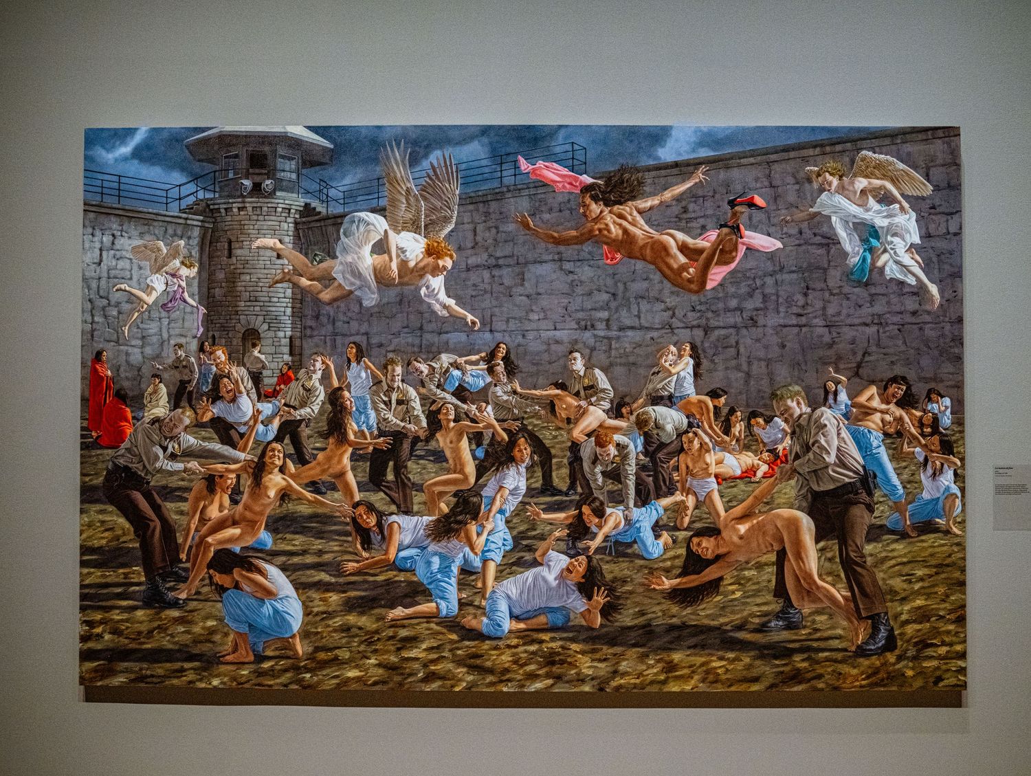 A dynamic mural depicting people dancing and floating in the air against a stone wall backdrop in an energetic scene.