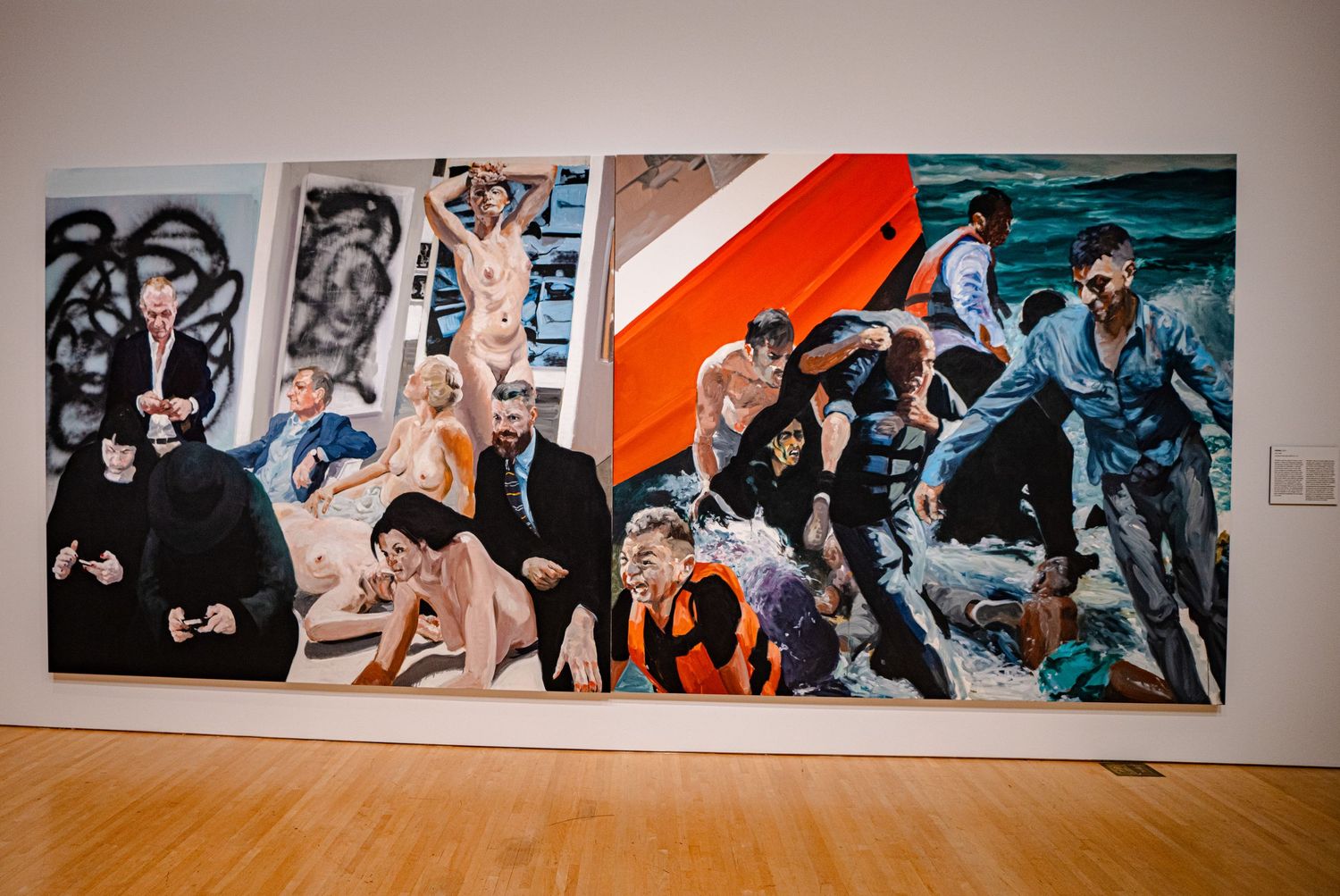 Large contemporary painting displayed in gallery featuring dramatic figurative scenes with bold colors and expressive brushwork.
