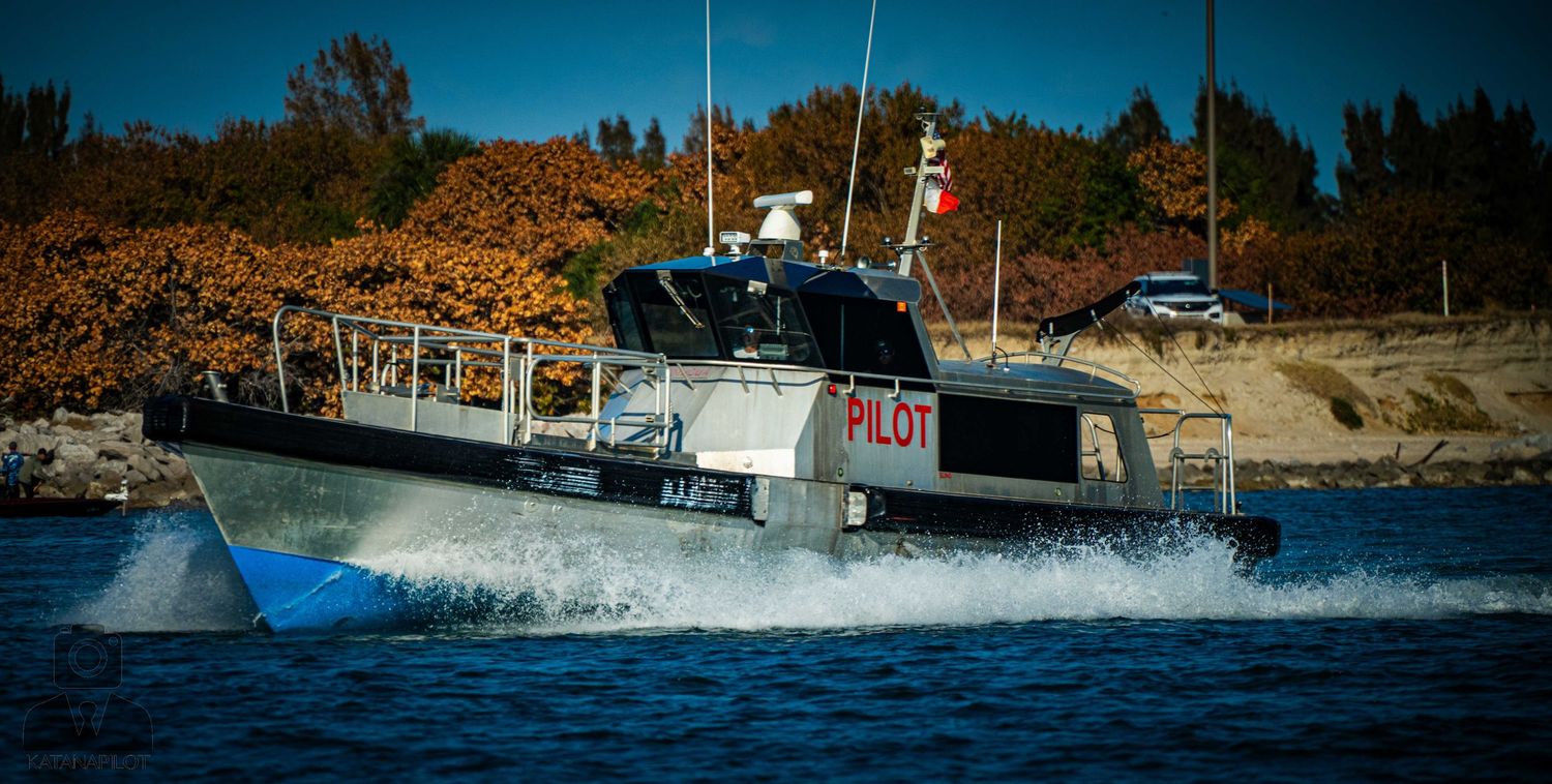 A series of panoramic shots showing a boat moving through choppy waters against a scenic coastal backdrop.