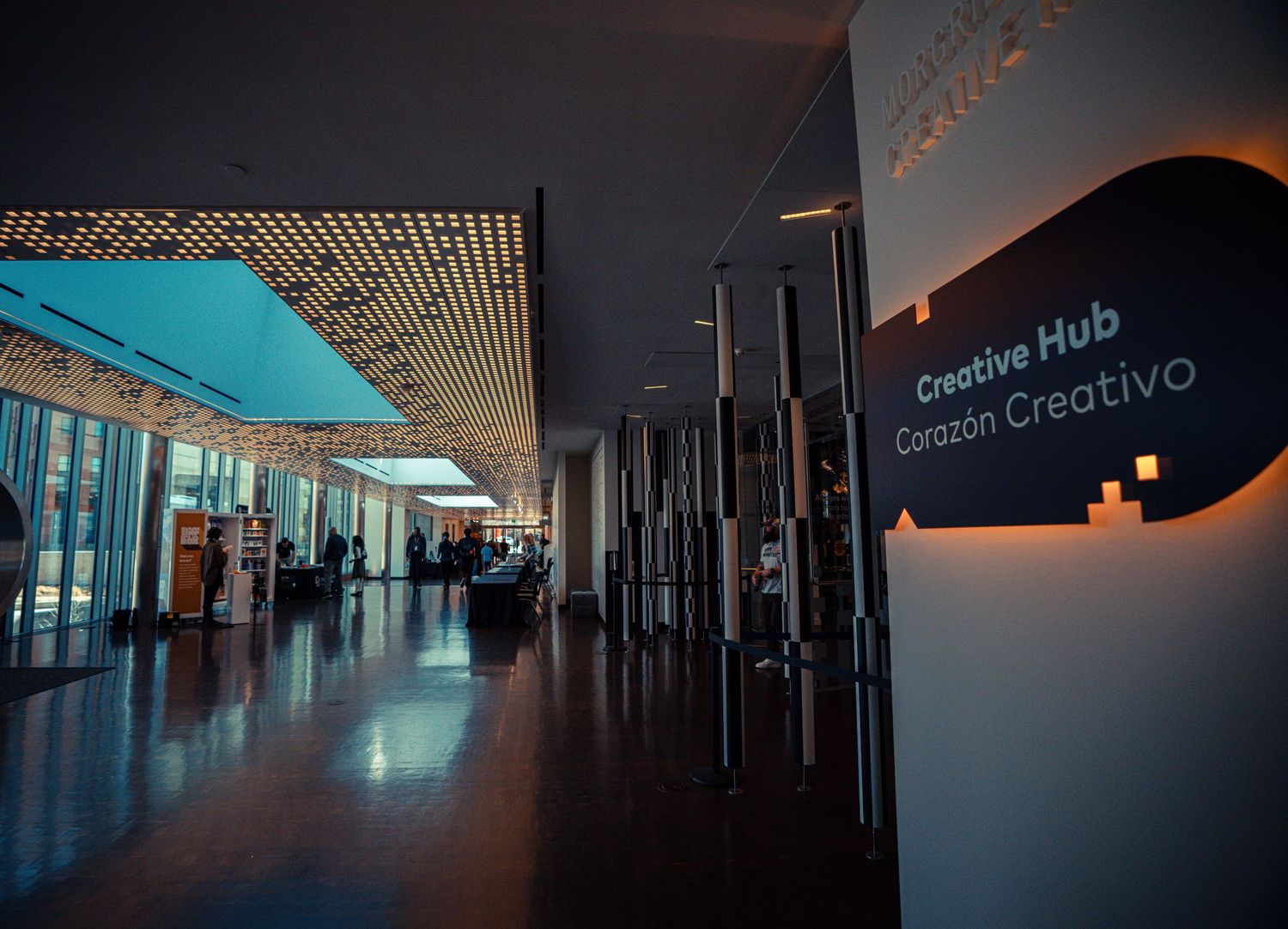 Long dark corridor with modern architectural elements and ambient lighting creating a moody atmosphere.