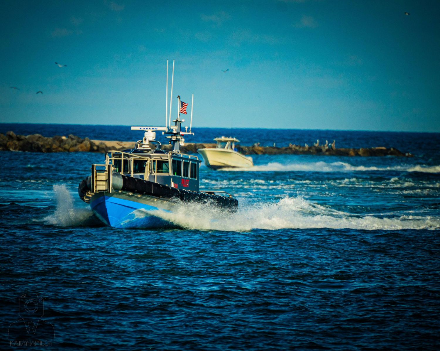 Series of action shots showing waves crashing against a boat in deep blue ocean waters.