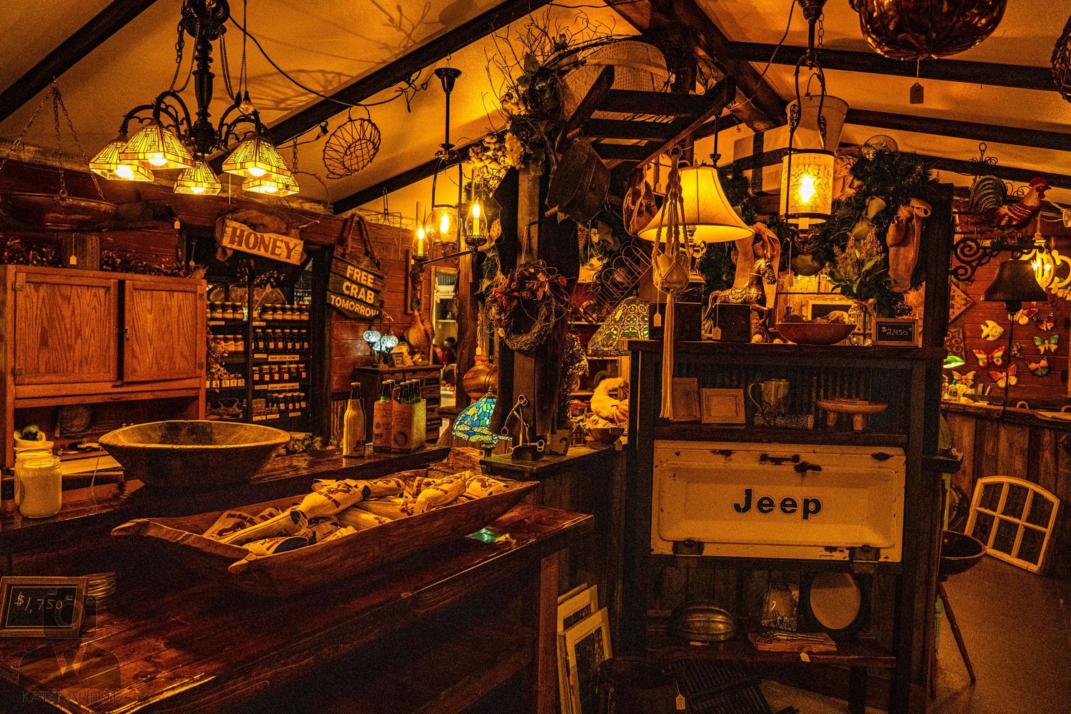 Panoramic view of an antique store's interior showcasing shelves packed with collectibles and memorabilia.