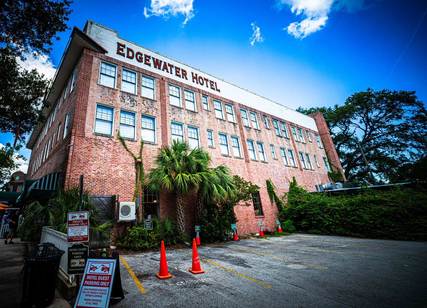 Exterior view of the Edgewater Hotel building with red brick facade.