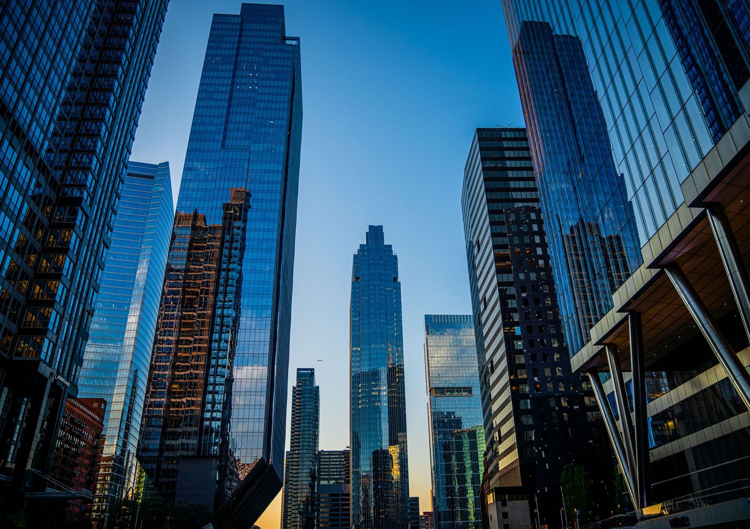 Modern skyscrapers in Chicago's financial district photographed from a low angle against blue sky.