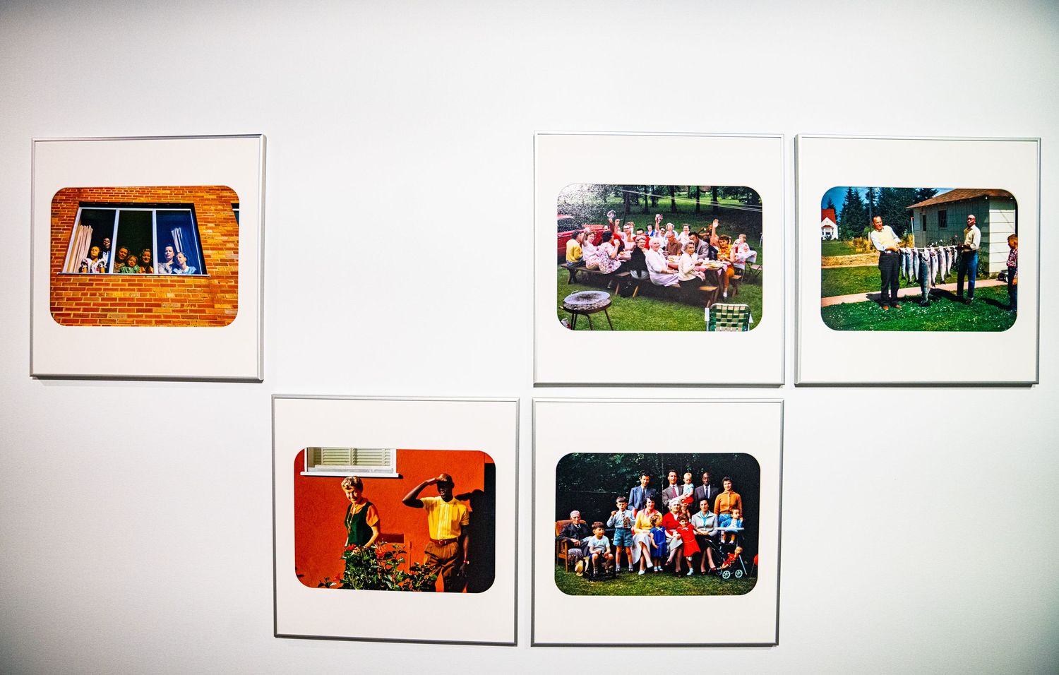 Art gallery display featuring multiple framed photographs in uniform presentation.