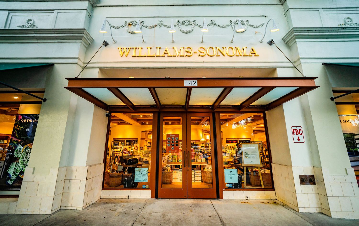 Storefront windows with ornate architectural details and classic signage.