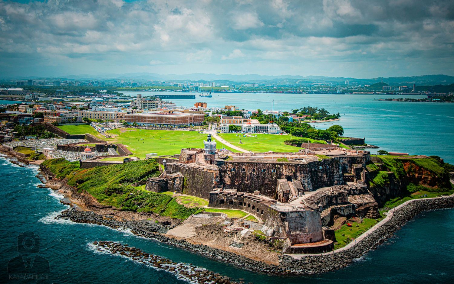 Panoramic landscape of a seaside military fort with stone ramparts and strategic coastal position.