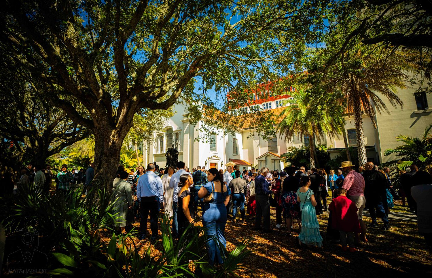 Tree-lined pathway filled with visitors exploring the historic streets of The Rocks neighborhood in Sydney.