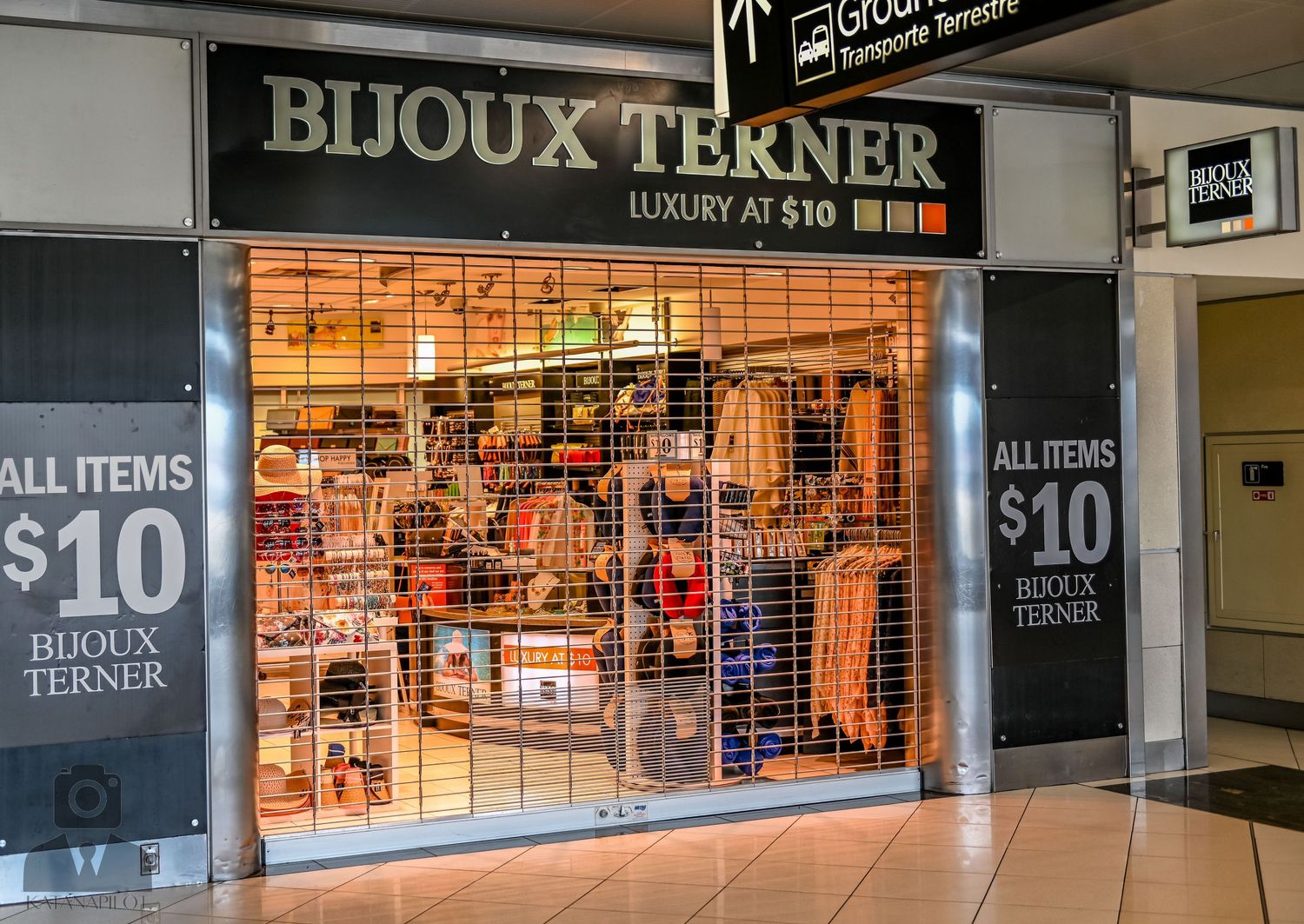 Bijoux Terner accessories store with all items $10 signage and security gate.