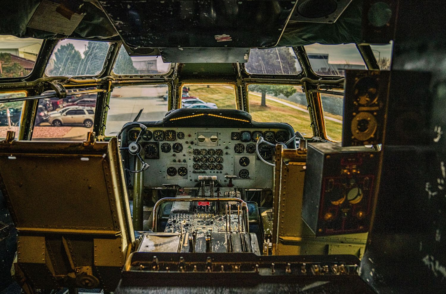Vintage control panel with analog gauges, switches, and dials in an industrial or transportation setting.