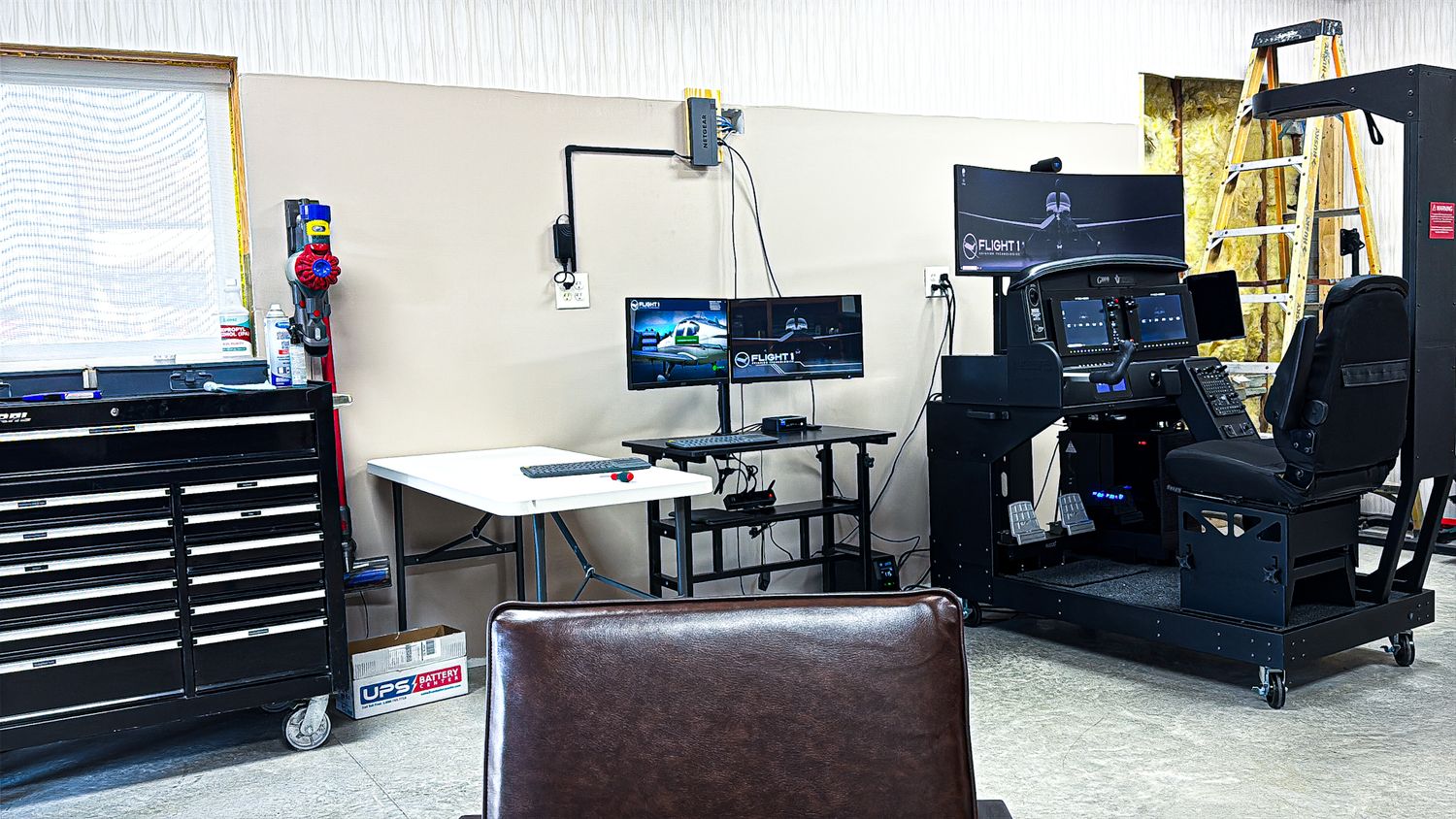 Professional workstations with multiple computer monitors and equipment arranged in a row.