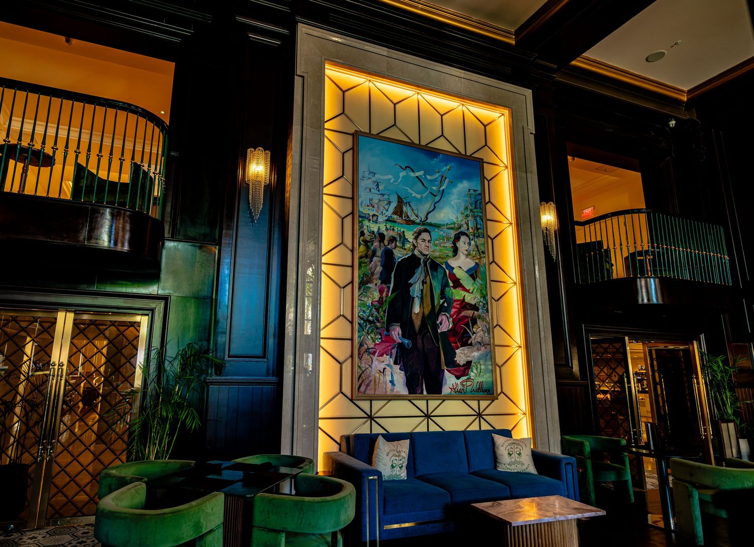 Elegant bar lounge with teal velvet seating, gold geometric wall art, and a vibrant tropical painting centerpiece.