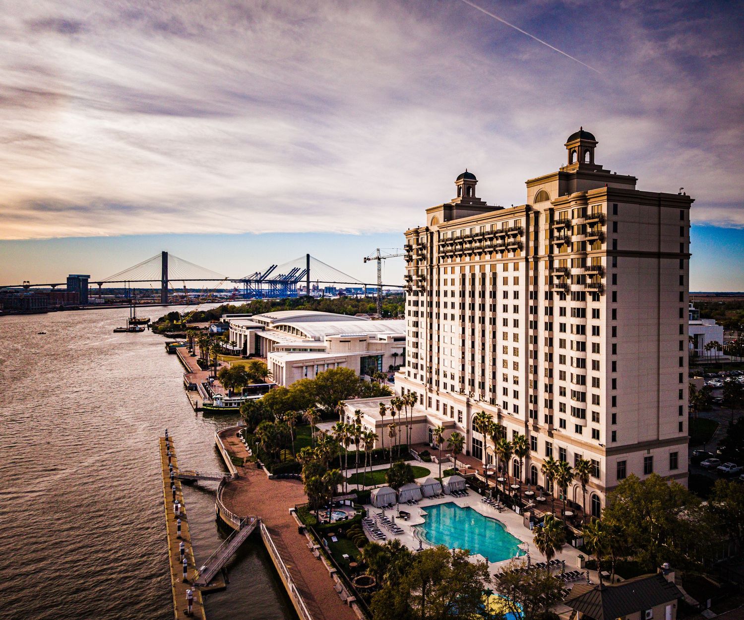Aerial view of the Westin Savannah Harbor Golf Resort and Spa with pool overlooking Savannah River and Talmadge Bridge.