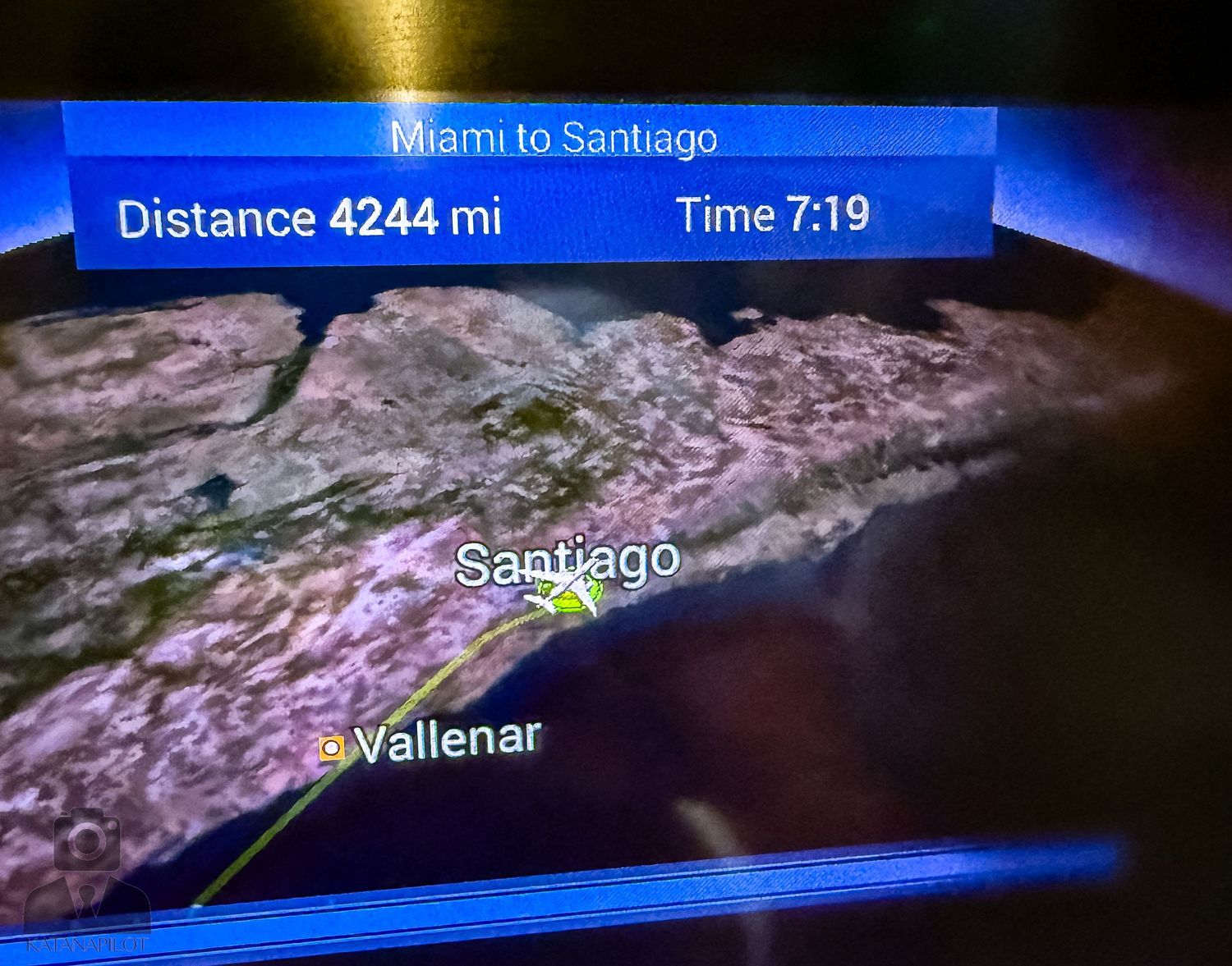 Flight information display showing distance and time from Miami to Santiago.