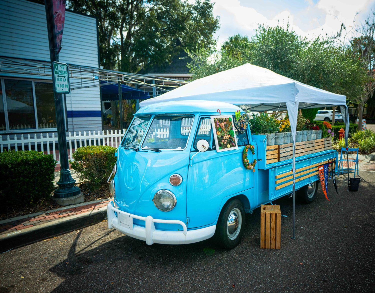 A vintage turquoise station wagon with wood paneling sits parked outside a house in multiple views.