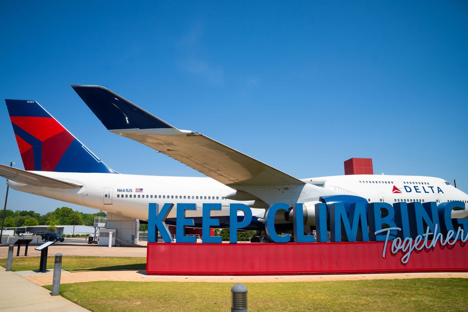 Commercial airplanes parked at an airport terminal with Delta Airlines branding visible.