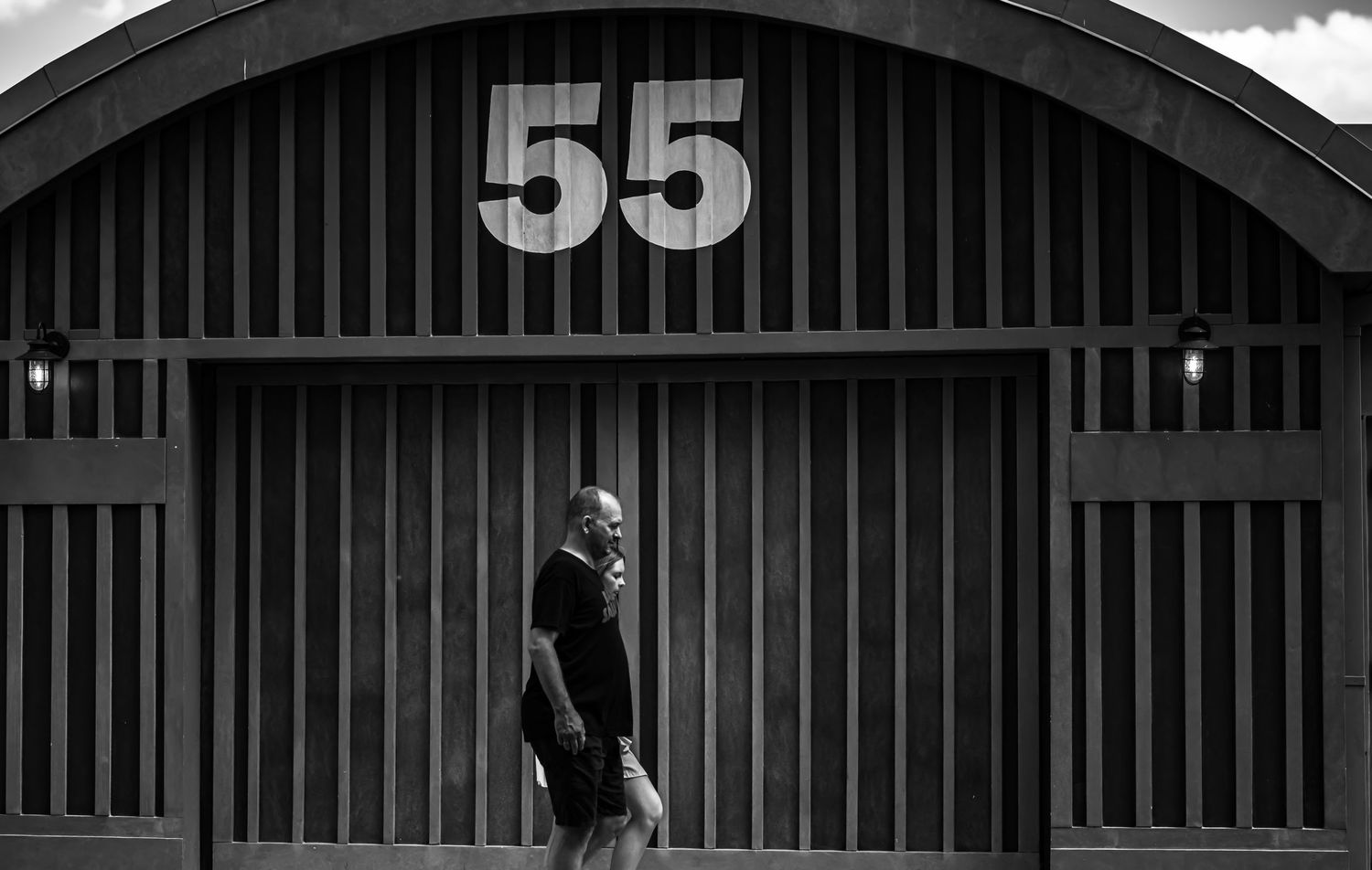 A dramatic black and white architectural series showing industrial building details with the number 55 prominently displayed.