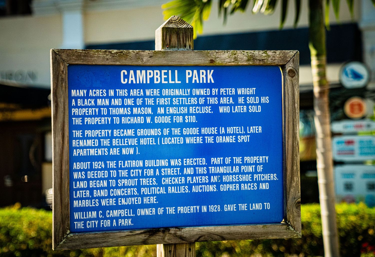 A series of blue informational signs mounted on posts at Campbell Park displaying rules and regulations.
