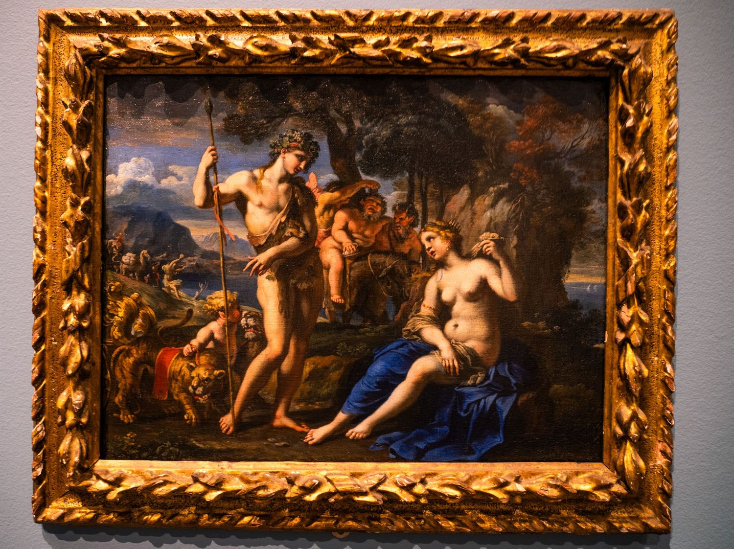 Series of classical paintings in ornate gold frames displayed in a museum gallery.