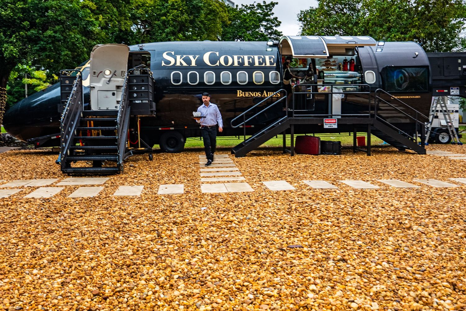 Sky Coffee mobile cafe truck stationed on fallen leaves during autumn.