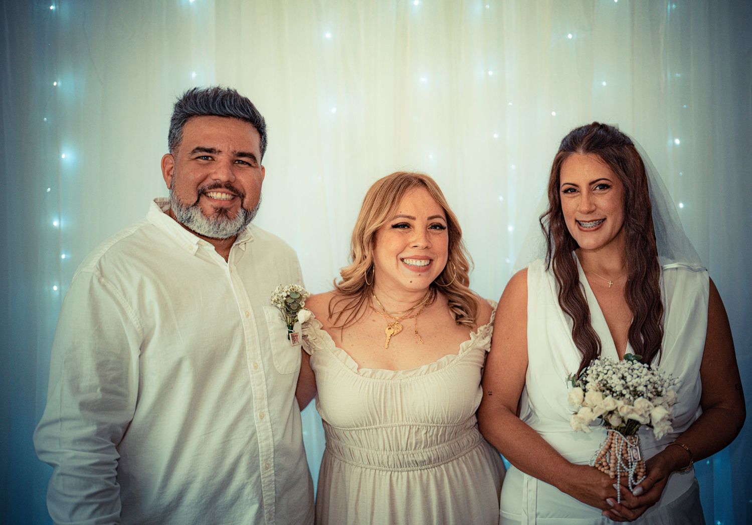 A series of wedding photos showing romantic moments between the couple in a soft teal-tinted lighting effect.