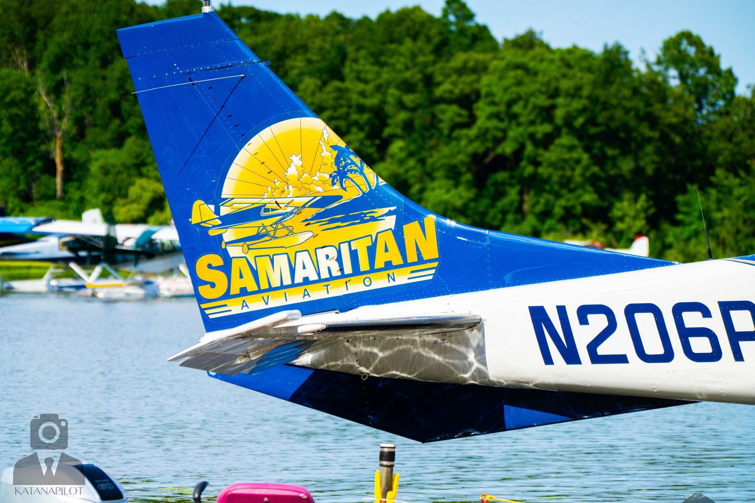 Samaritan Aviation logo detail on blue and white aircraft tail fin.