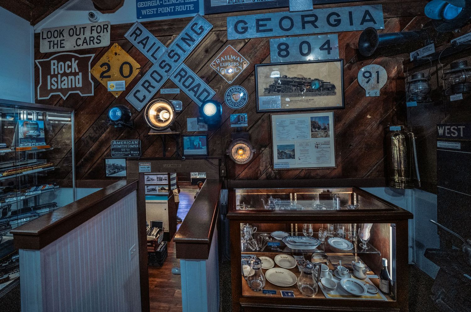 Vintage signs and memorabilia decorating the walls of a rustic restaurant interior.