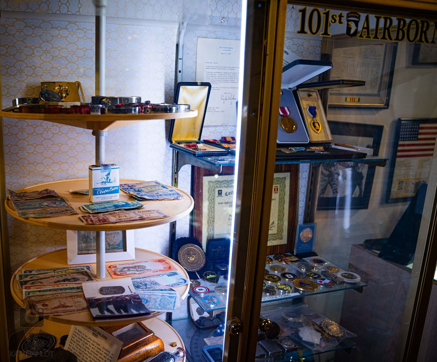 Aviation museum display room with curved desk and historical memorabilia.