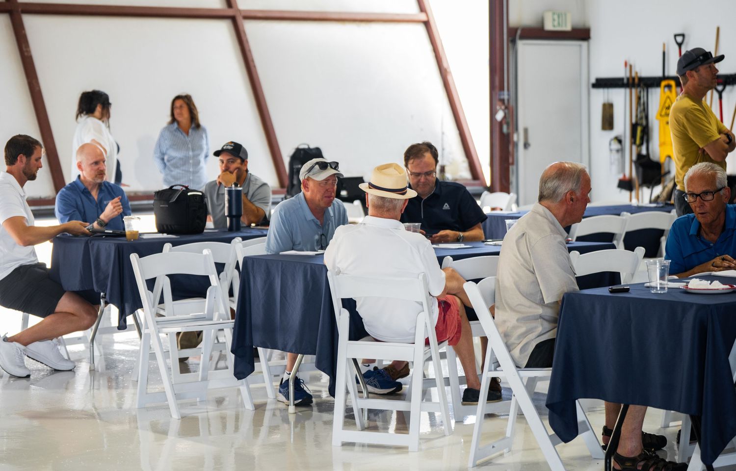 Training facility interior showing multiple workstations and students engaged in aviation instruction.