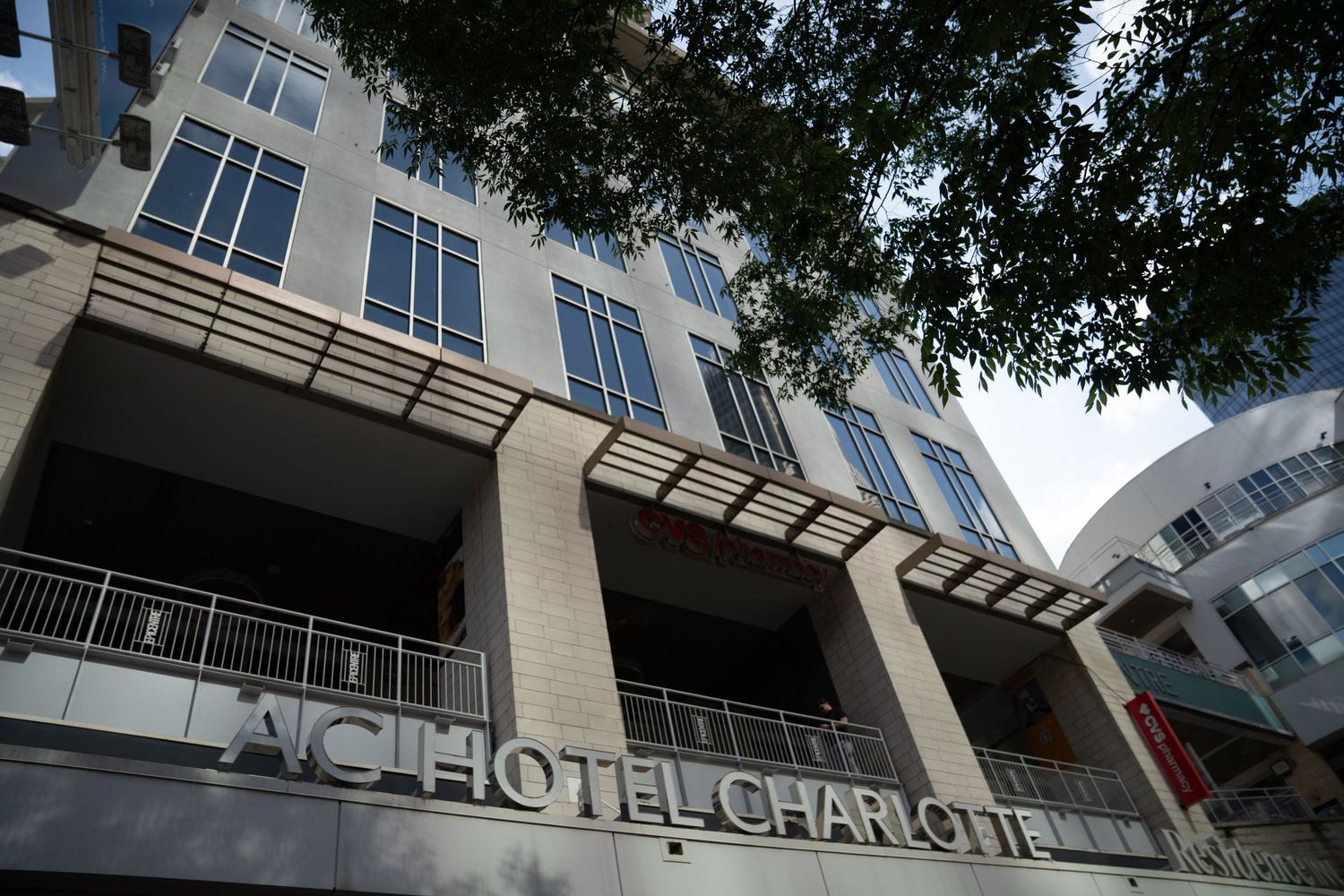 Modern hotel exterior with Hotel Charlotte signage visible on building facade.