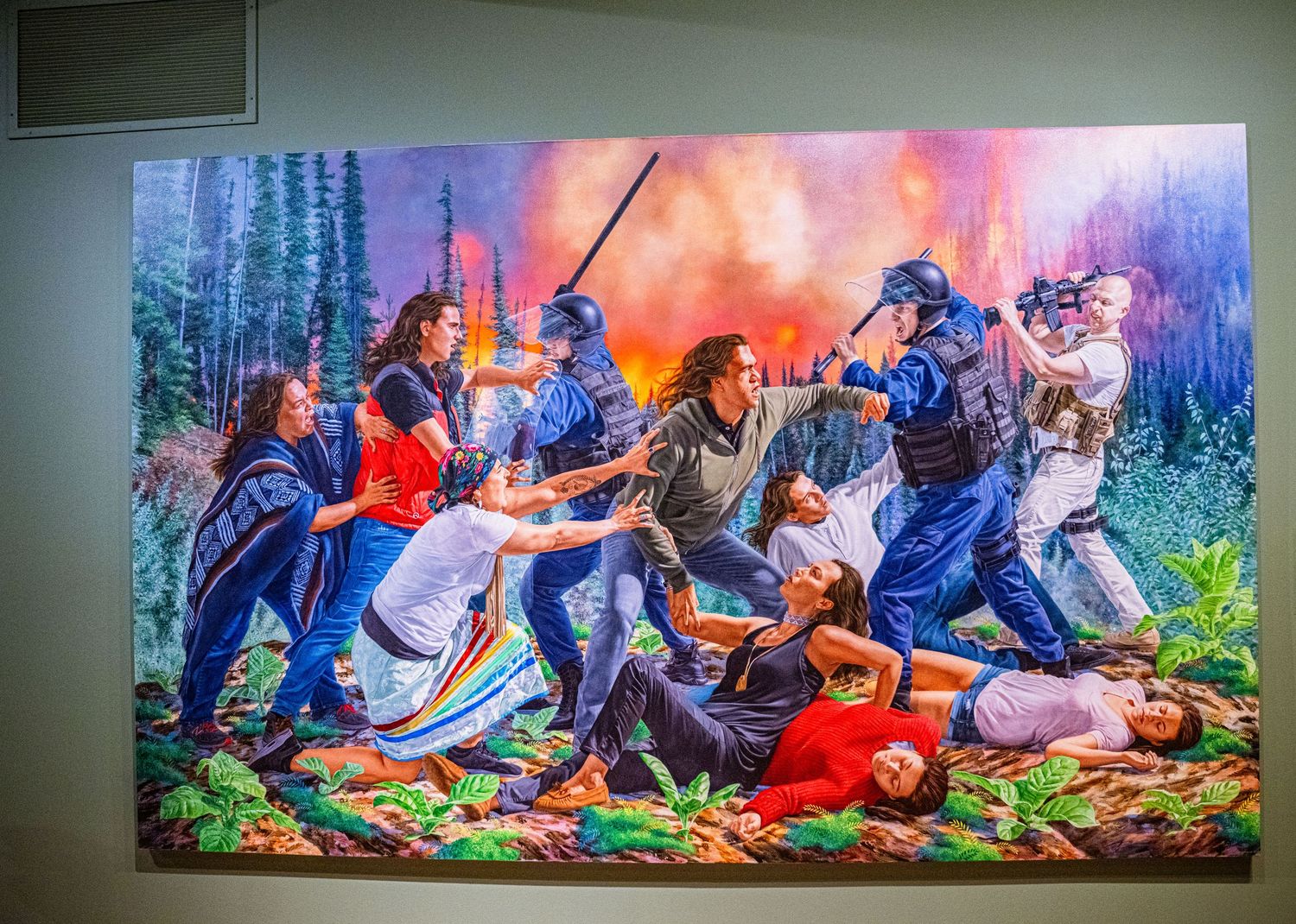 A colorful panoramic mural depicting figures resting in a vibrant forest landscape with blue and orange hues.