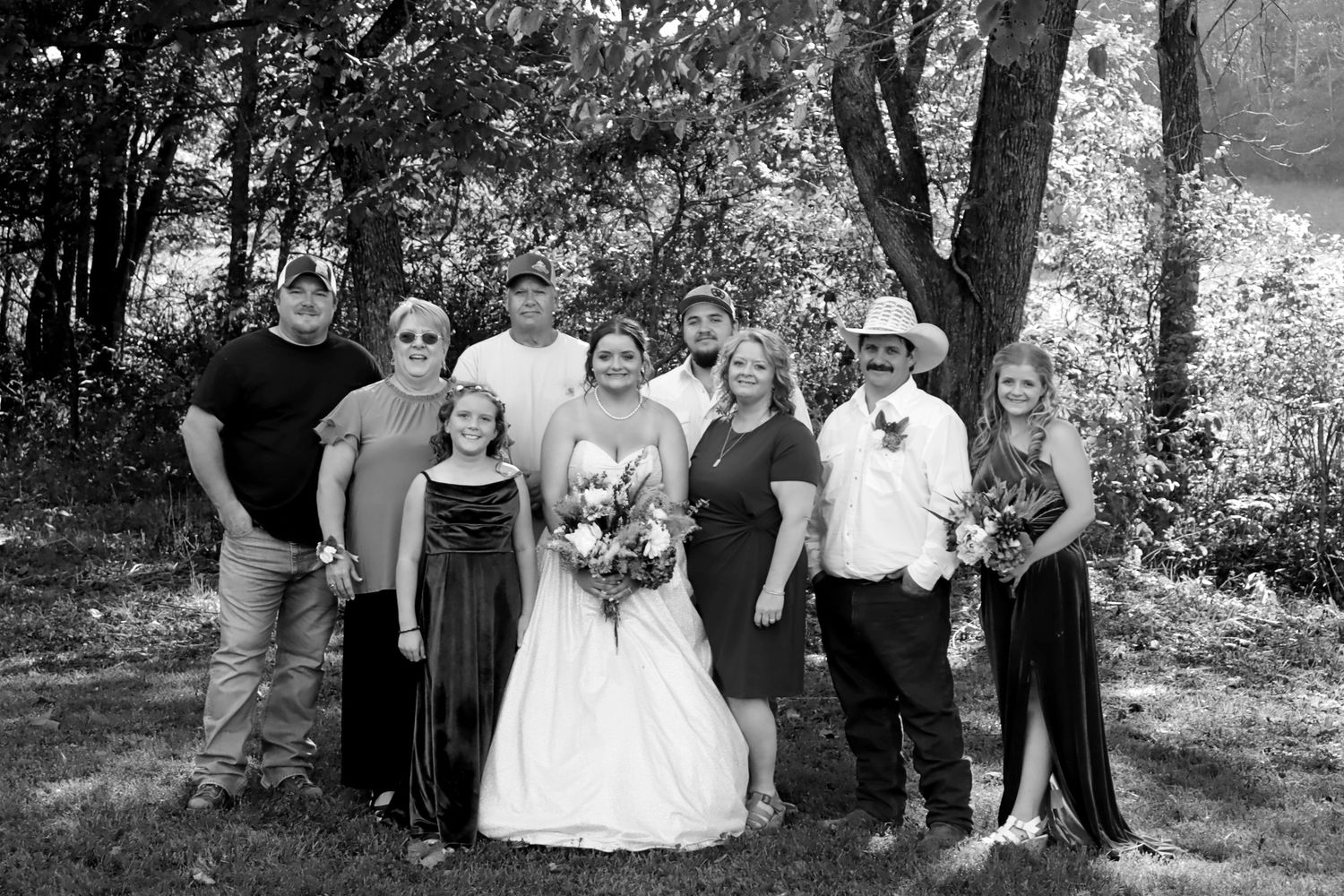 A wonderful bride at her wedding with her immediate family.