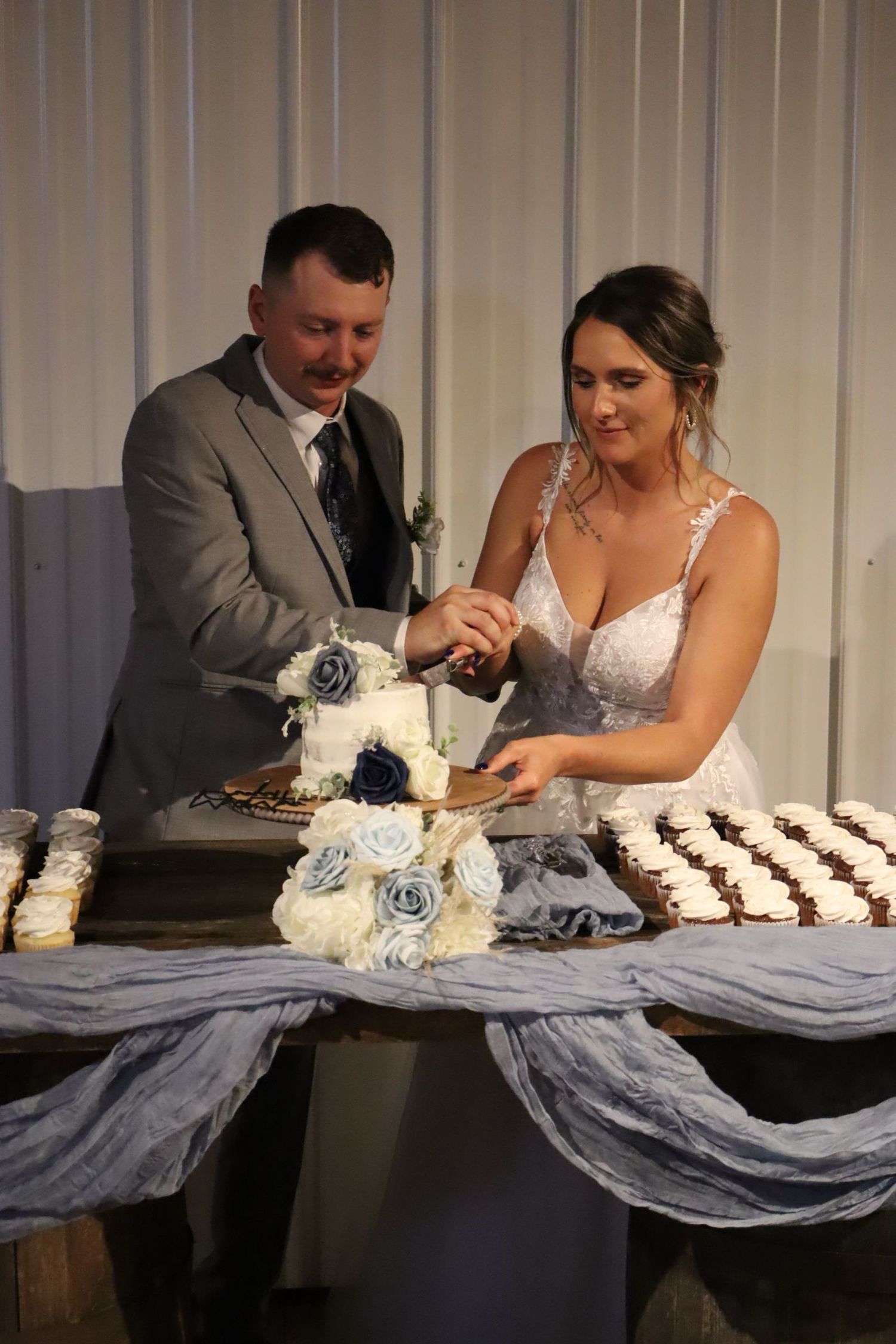 Here is the bride and groom cutting the cake.