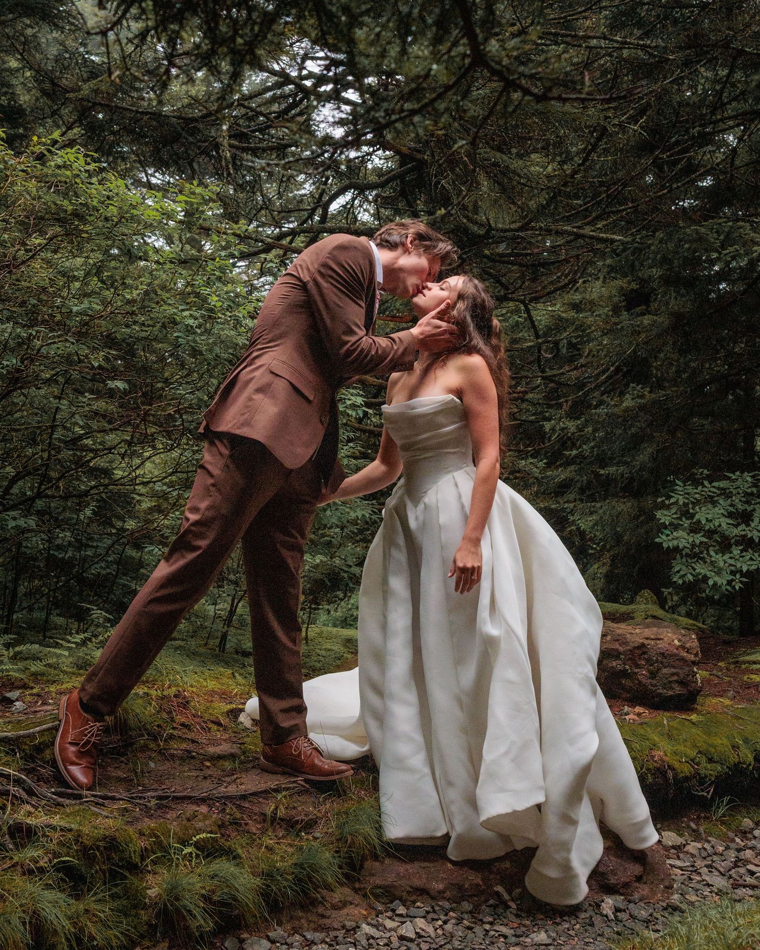 A romantic wedding moment captured in sequence showing playful poses between a couple in a forest setting.