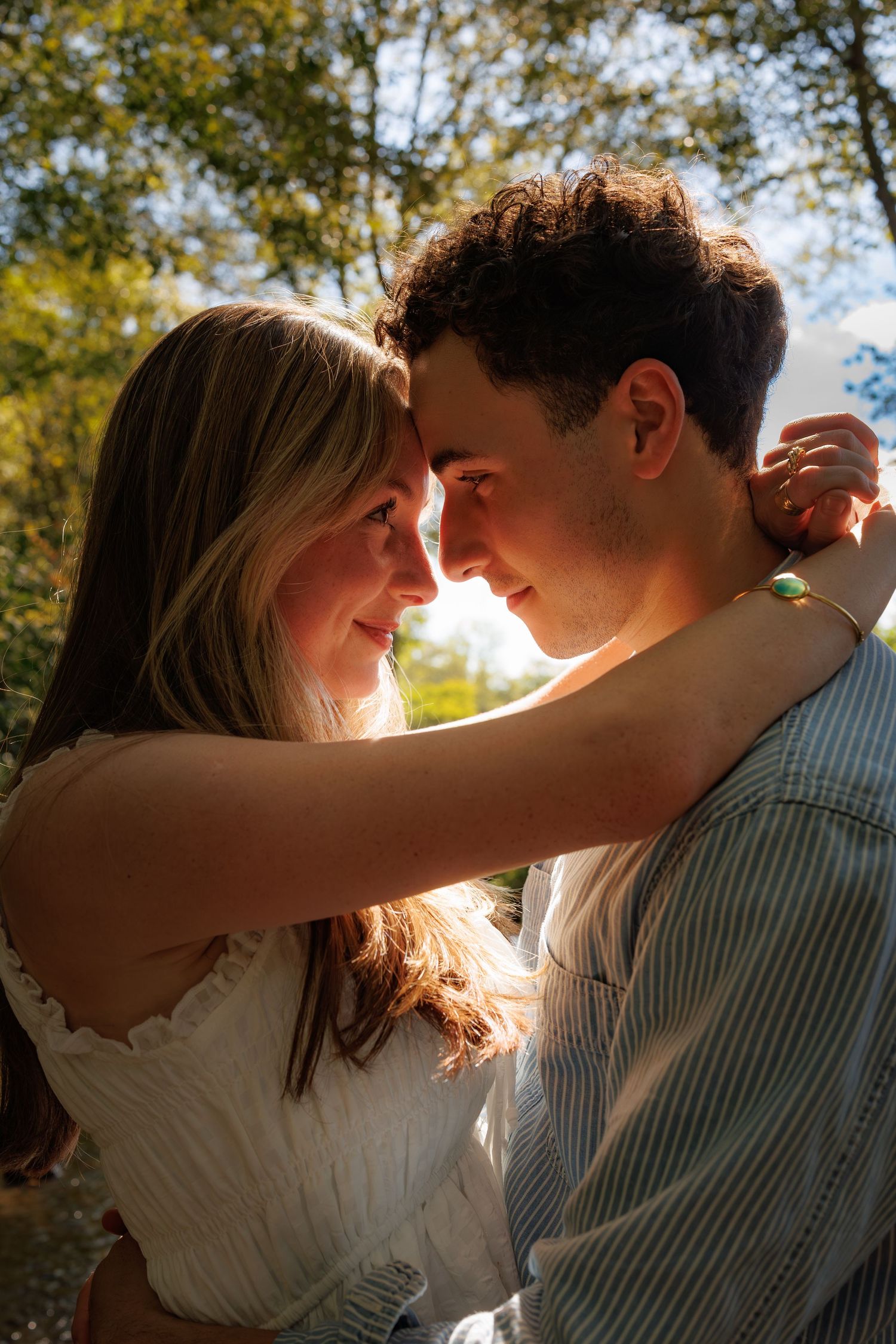 Romantic couple shares intimate moments in late afternoon sunlight through a series of close-up silhouettes.