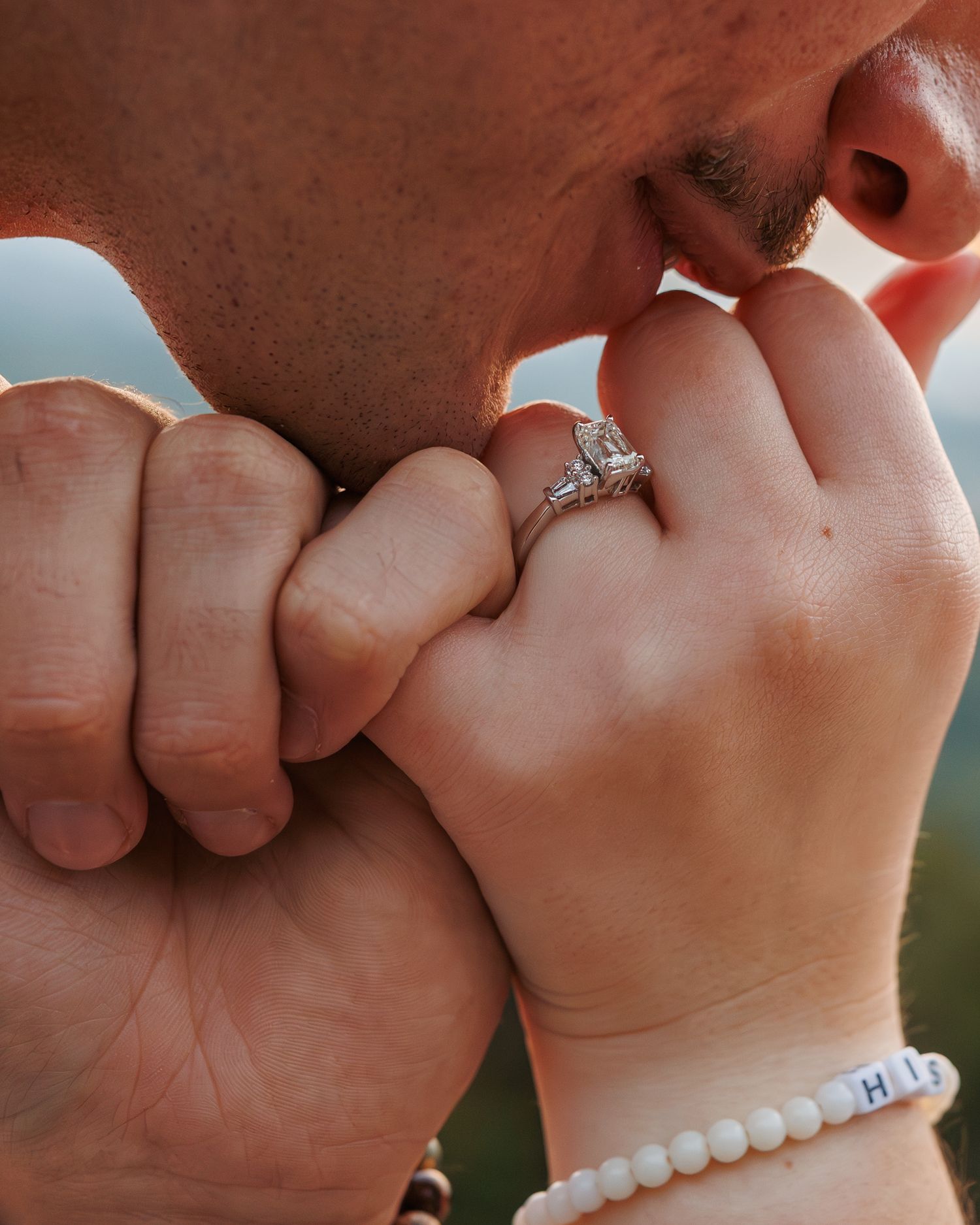 Seven close-up photos showing hands with engagement rings linked together in a pinky promise gesture.