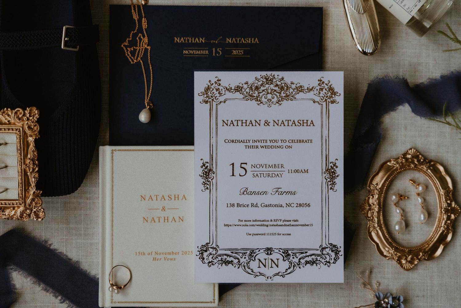 Elegant wedding invitation suite for Nathan and Natasha with navy and gold accents, jewelry, and ornate frames.