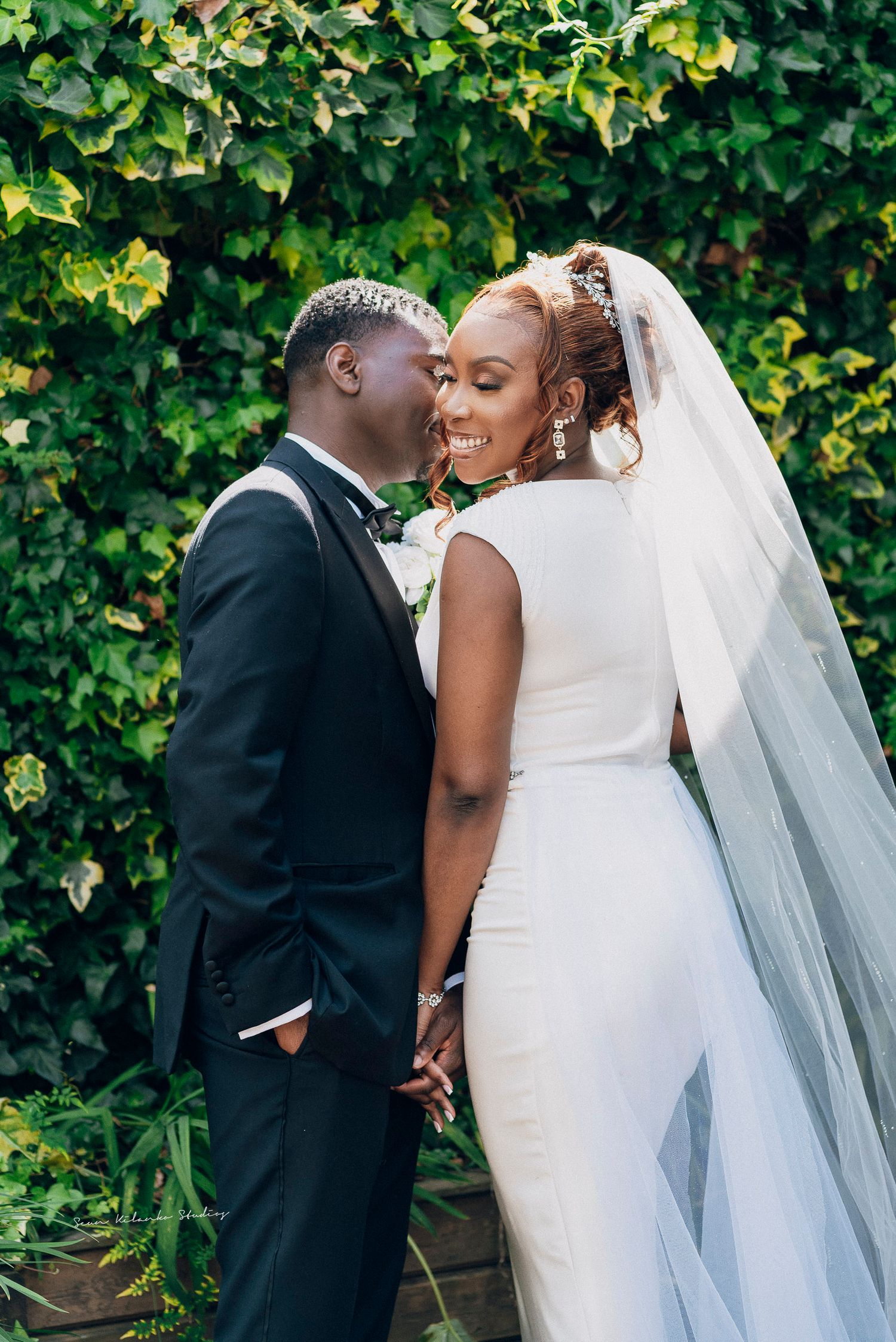 A romantic wedding photo sequence showing tender moments between a couple against a lush green hedge background.