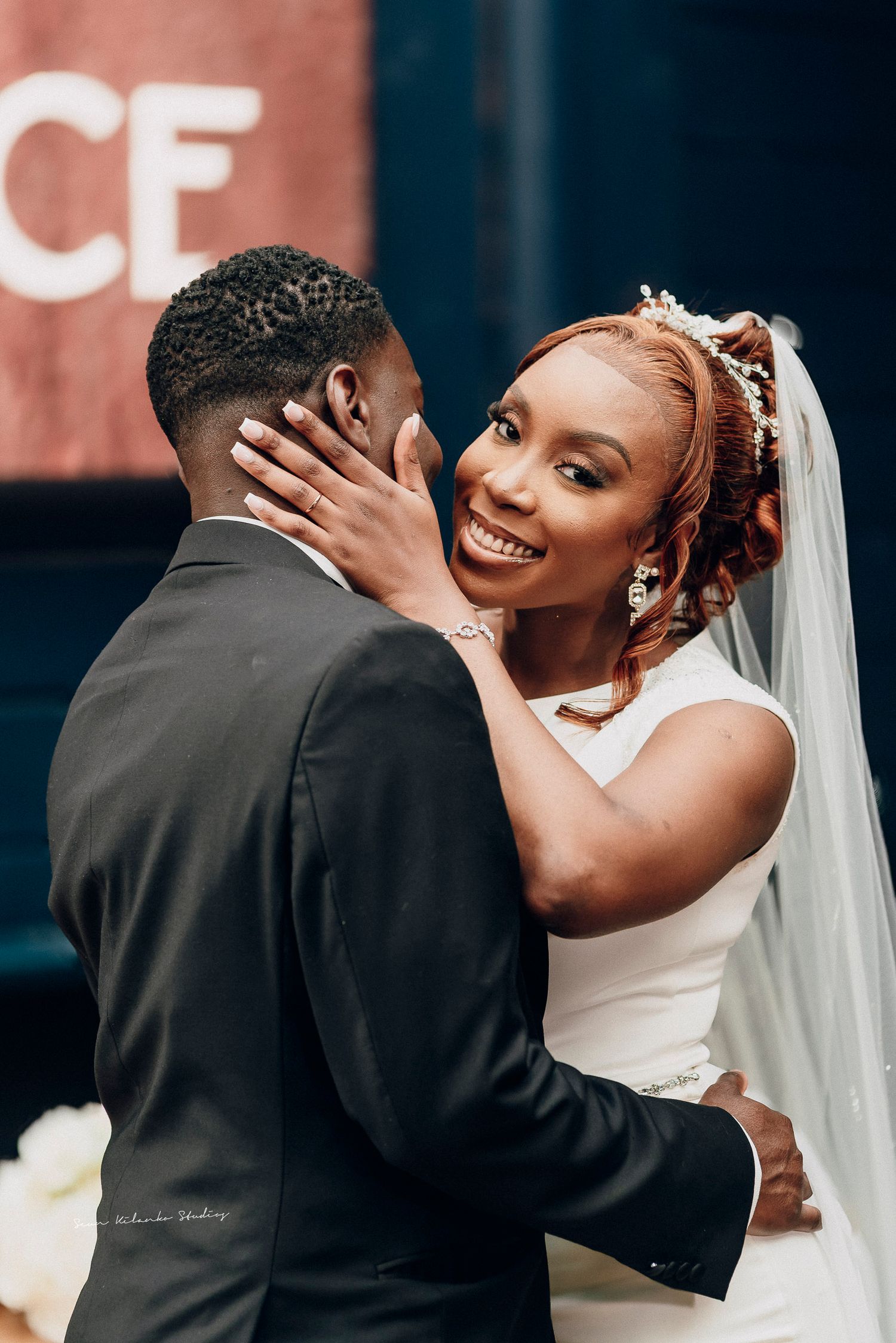 A romantic sequence of wedding photos shows a couple in black and white attire sharing intimate moments during their celebration.