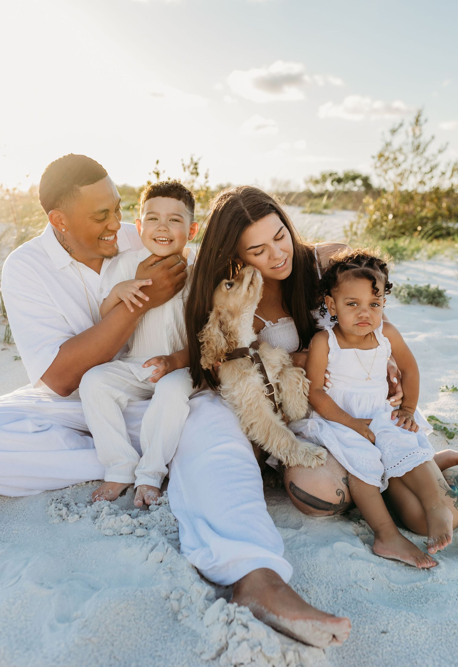 family of four with dog
