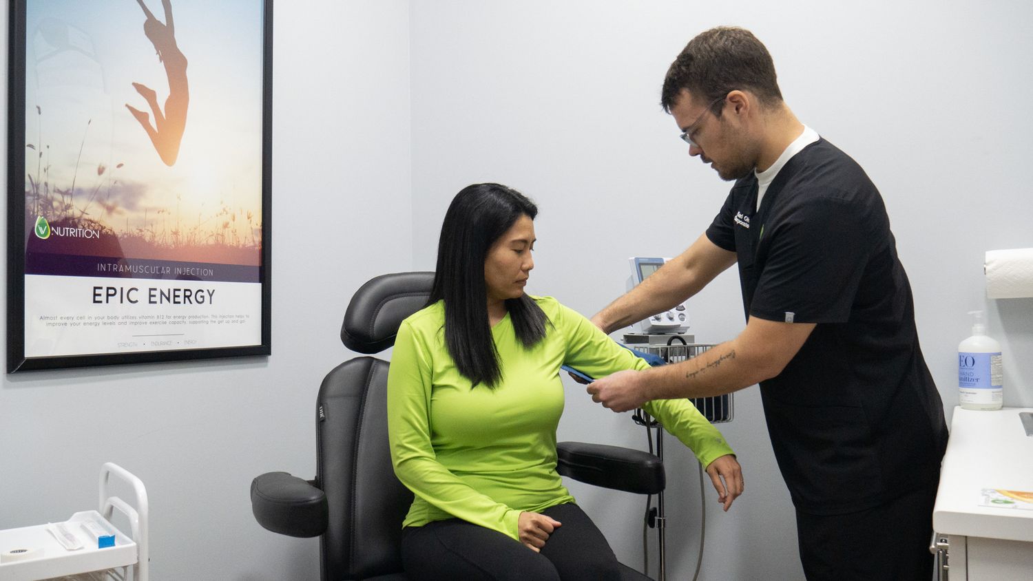 Healthcare professional administering an IV therapy treatment to a patient at an Epic Energy wellness clinic.