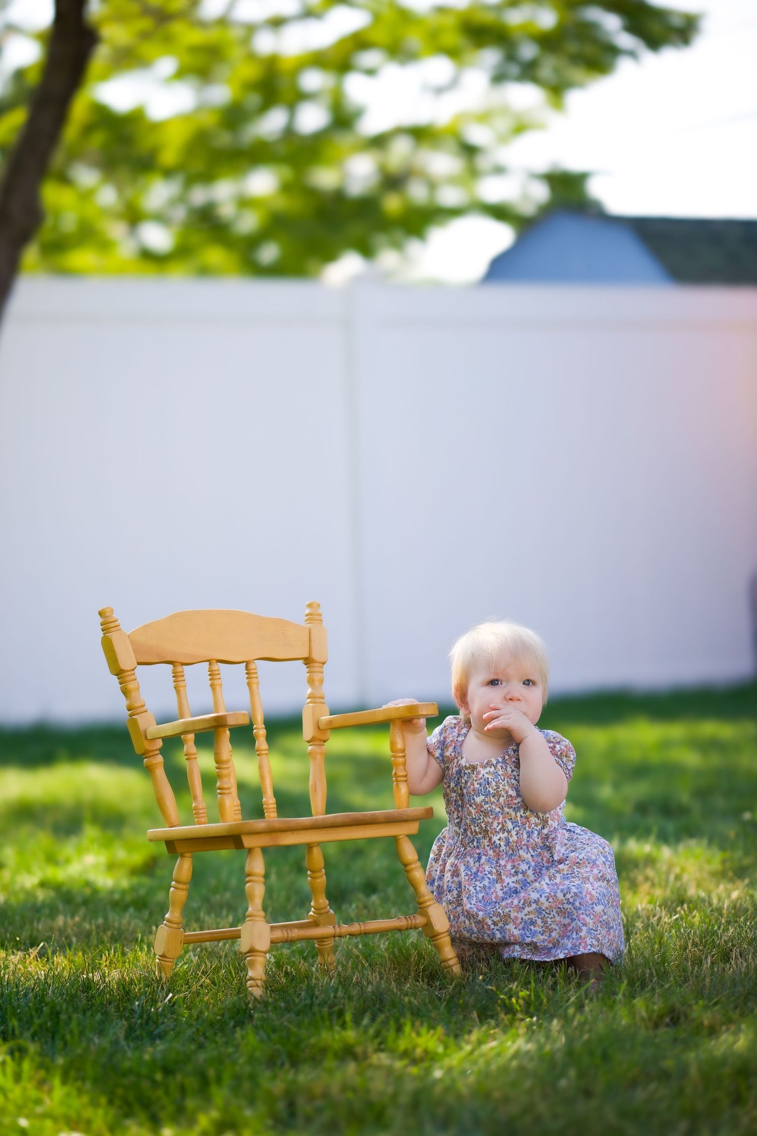 A sequence of three photos showing a small wooden bench on grass with soft bokeh lighting in a sunny outdoor setting.