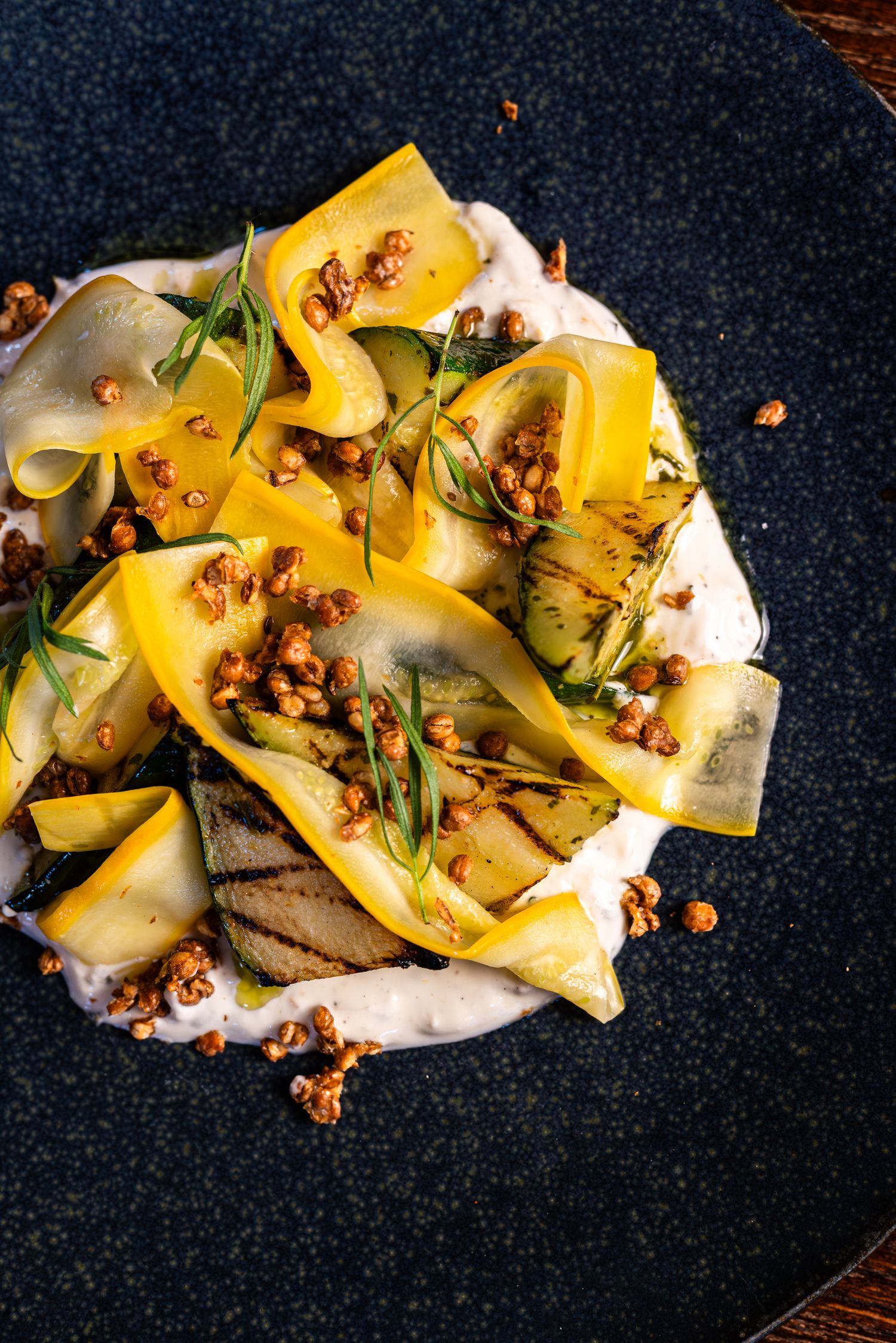 colourful photo of a dish with yellow and green zucchini